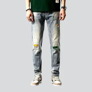 Grunge men's distressed jeans